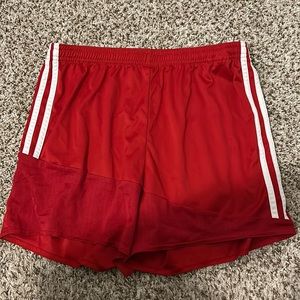 Women’s medium red adidas soccer shorts with tie waistband.